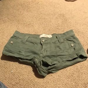Green army shorts.